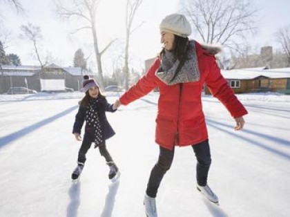 a mom and daughter ice skating